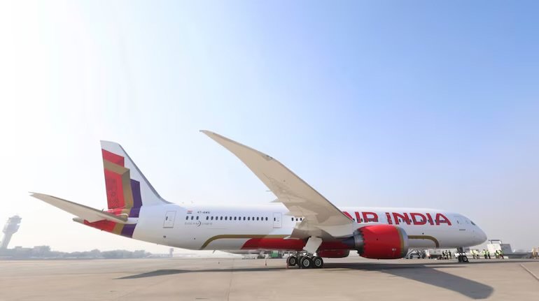 An Air India Boeing 787 Dreamliner in the airline's current livery, parked on the apron