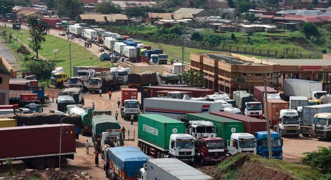Lines of freight trucks queueing at a busy African land border crossing