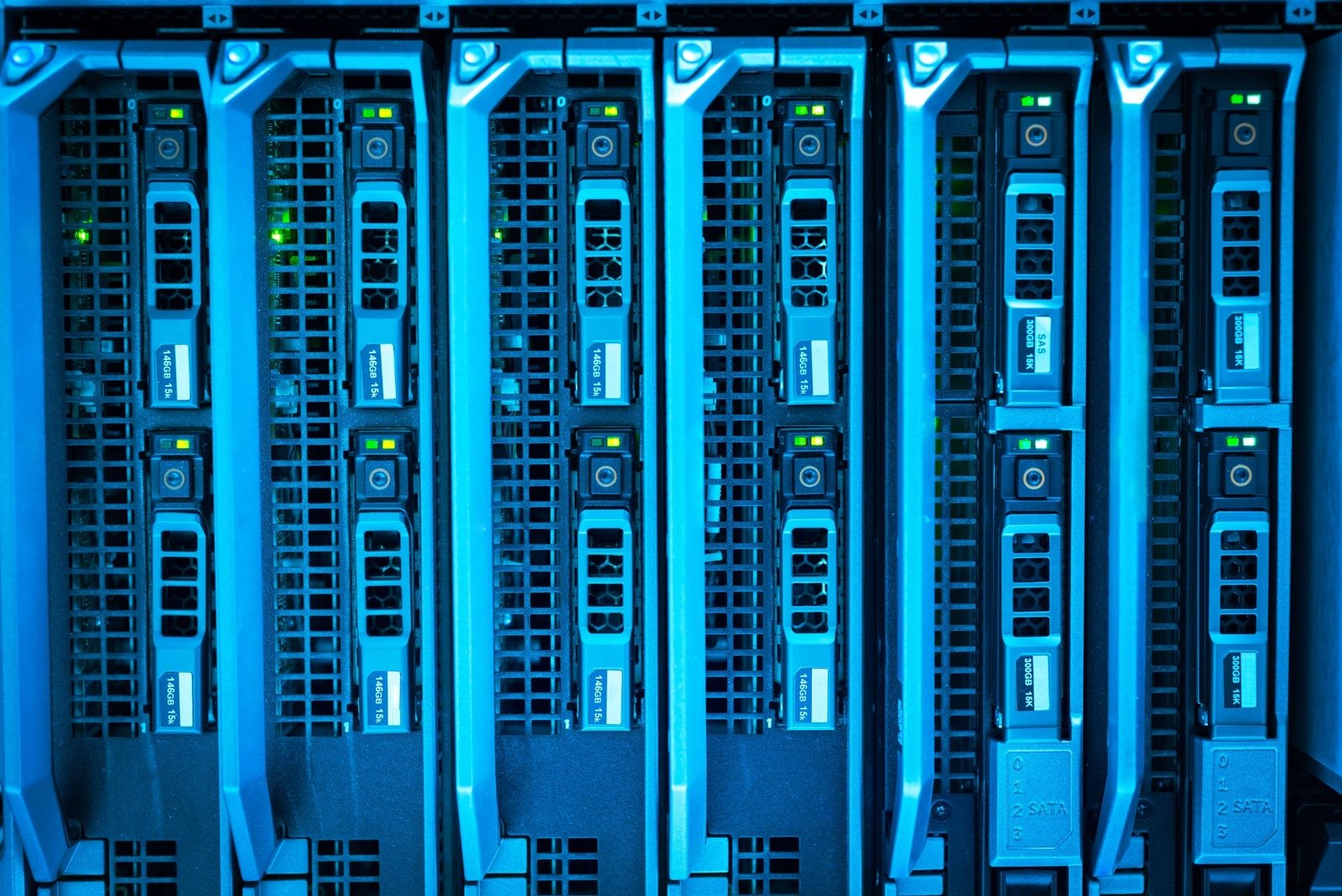 Rows of blade servers in a data center rack, lit blue